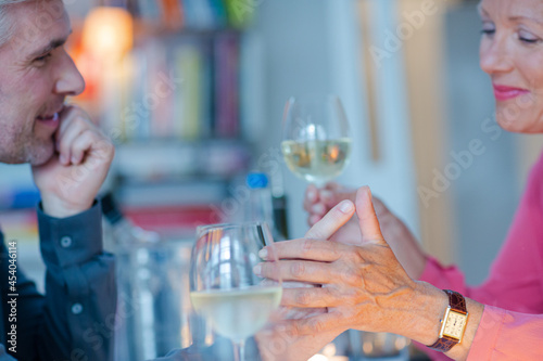 Close up of romantic older couple holding hands