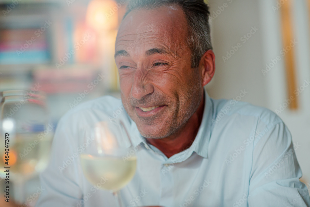 Older man drinking white wine Older man drinking white wine