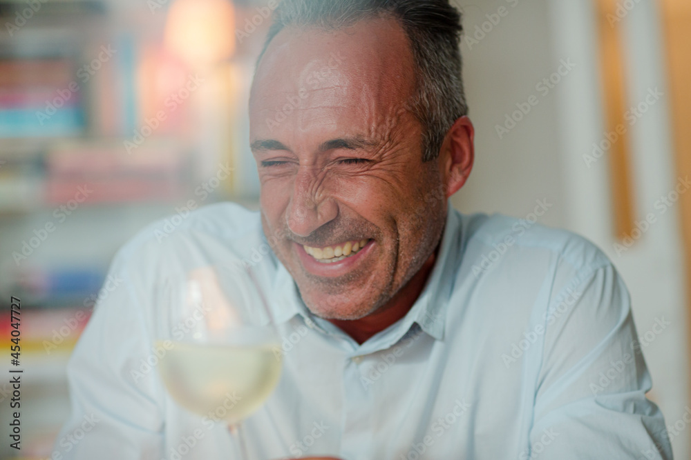 Older man drinking white wine Older man drinking white wine