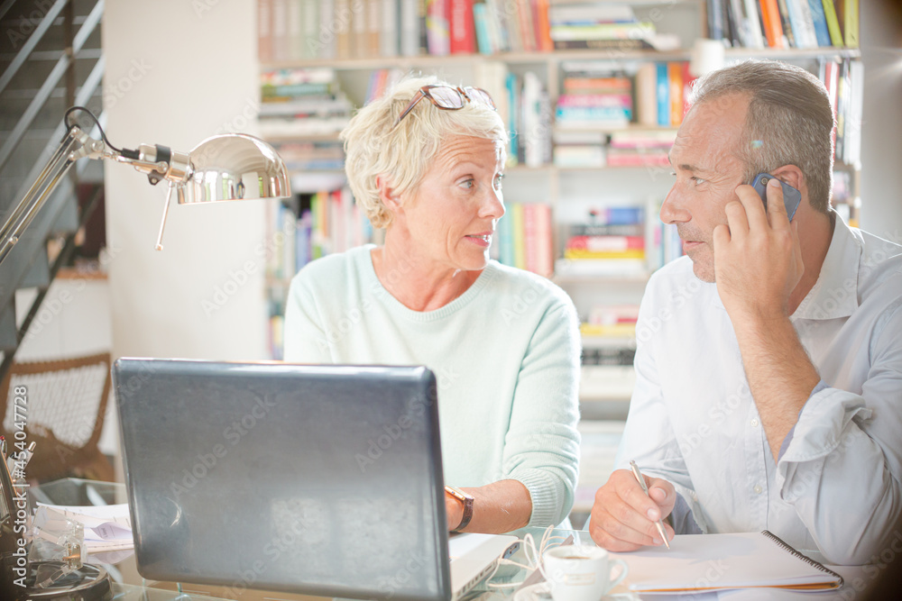 Business people working together at home office desk Business people working together at home office desk