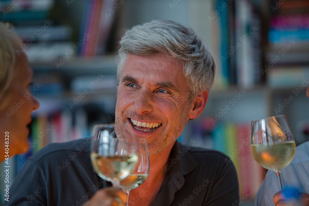 Older friends tasting white wine Older friends tasting white wine