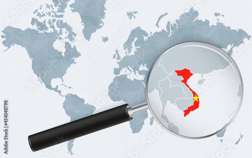 World map with a magnifying glass pointing at Vietnam. Map of Vietnam with the flag in the loop.