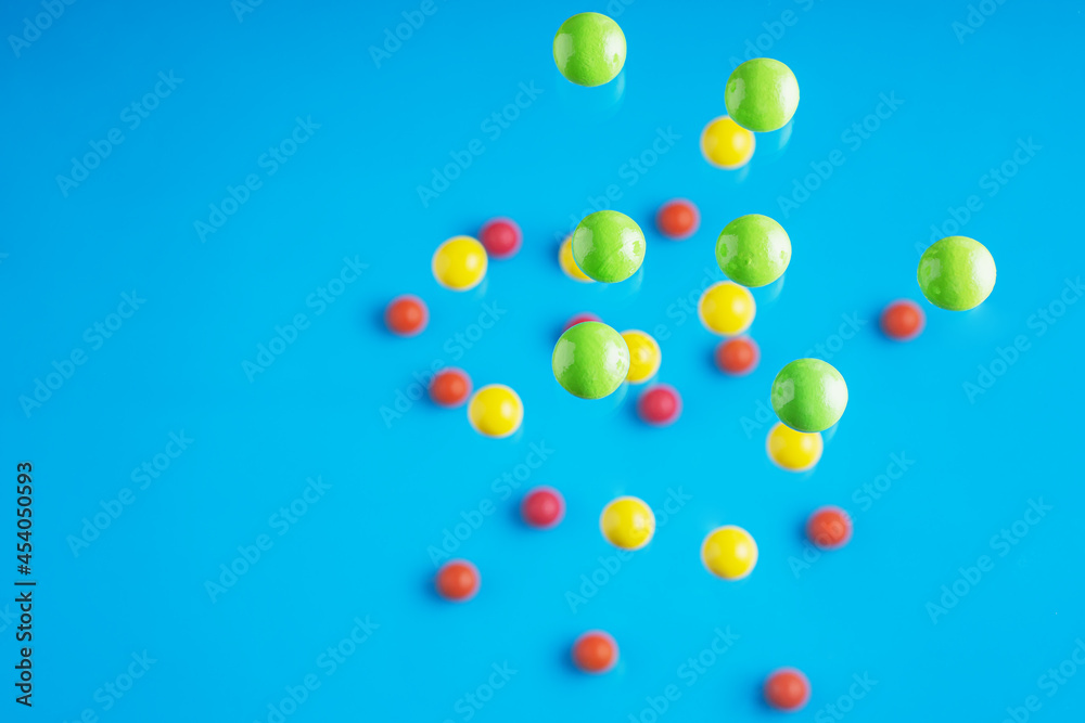 Colorful balls flowing upwards on blue background. .Abstract background with bright balls.