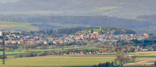 Panorama of the town of Klodzko with the Bardzkie Mountains in the background, view from a nearby hill.