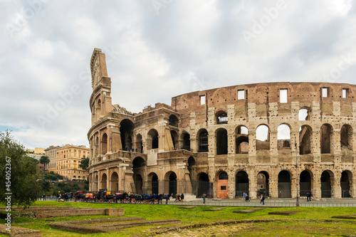 Colosseum, also known as the Flavian Amphitheater, commissioned in A.D. 70-72 by Emperor Vespasian, is the largest amphitheater ever built, made of concrete and sand., Rome, Italy
