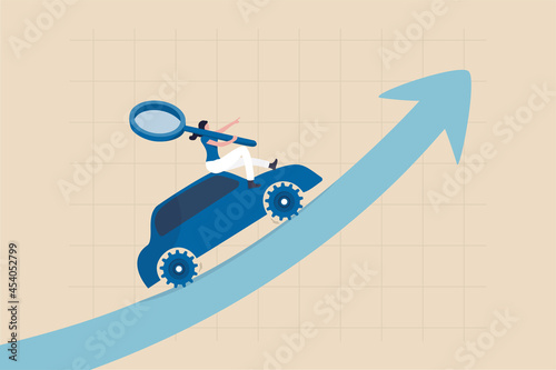 Data driven marketing using technology information to drive sell or advertising campaign, tracking user behavior analysis concept, woman marketer hold magnifying glass on data driven car growth graph.