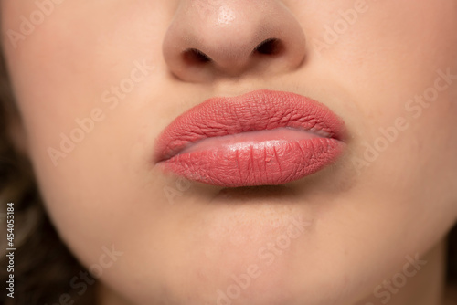 Photography lose up of sulkyand pouty sad female mouth