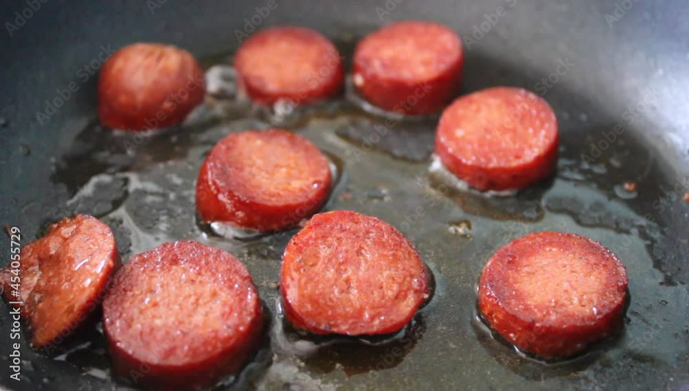 Fried sausage in the pan, cooking meat sausage Fried sausage in the pan, cooking meat sausage
