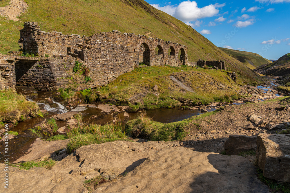 Fototapeta premium The remains of Blakethwaite Smelt Mill near Gunnerside, North Yorkshire, England, UK