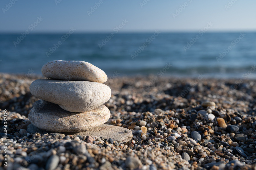 Pebbles stacked evenly on the beach Pebbles stacked evenly on the beach