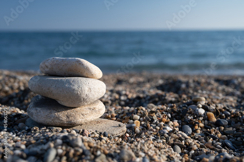 Pebbles stacked evenly on the beach
