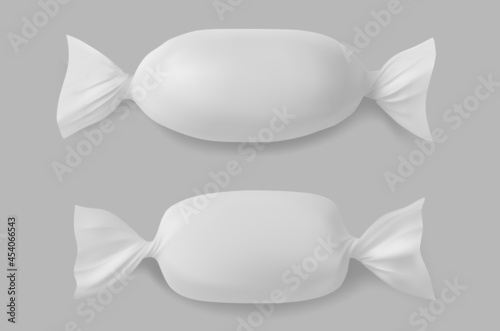 White polyethylene package for candies, isolated on grey background.