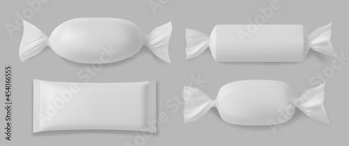 White polyethylene package for candies, isolated on grey background.