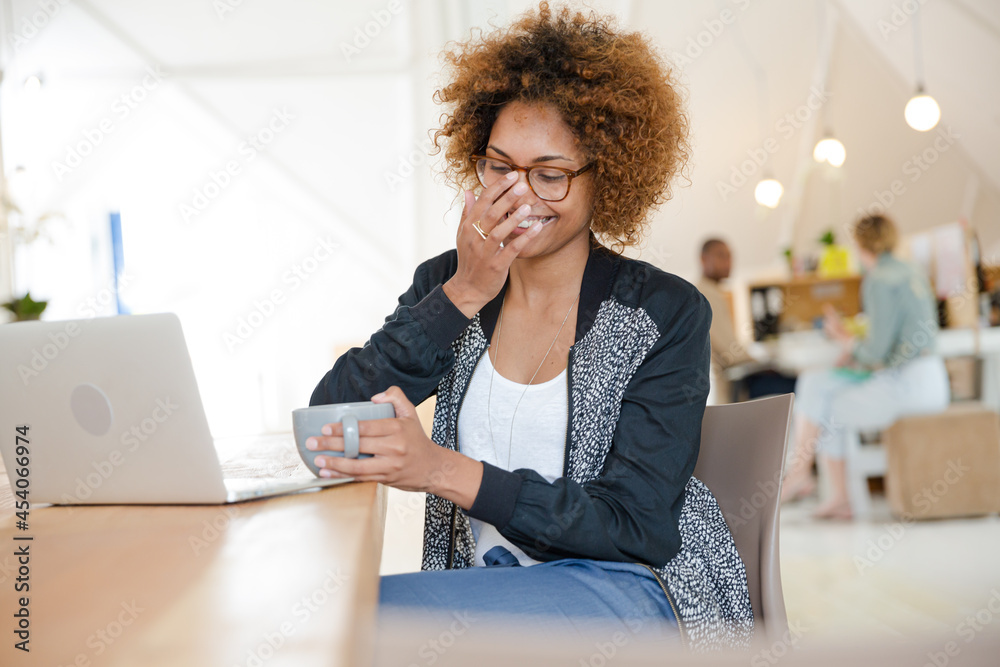 Fototapeta premium Office worker with coffee using laptop