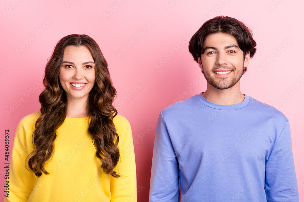 Photo of young cheerful couple boyfriend girlfriend happy positive smile glad content isolated over pink color background Photo of young cheerful couple boyfriend girlfriend happy positive smile glad content isolated over pink color background