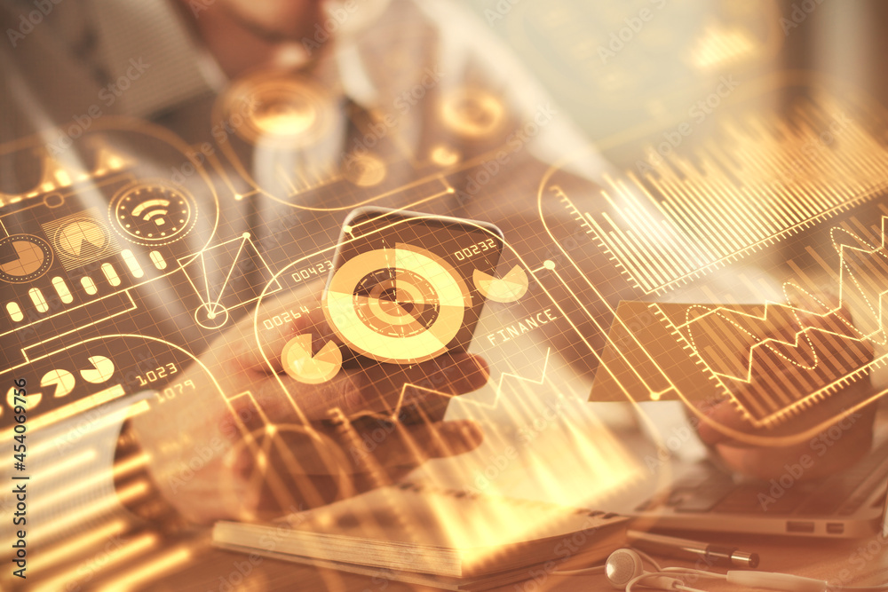 Double exposure of man's hands holding and using a digital device and tech theme hologram drawing. Technology concept. Double exposure of man's hands holding and using a digital device and tech theme hologram drawing. Technology concept.