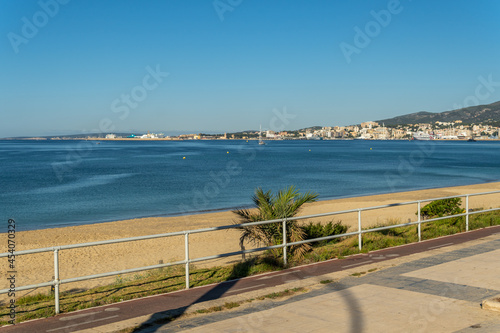 General view of Can Pere Antoni beach with the city of Palma de Mallorca in the background at sunrise photo