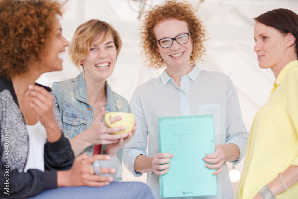 Fototapeta premium Portrait of female colleagues smiling in office