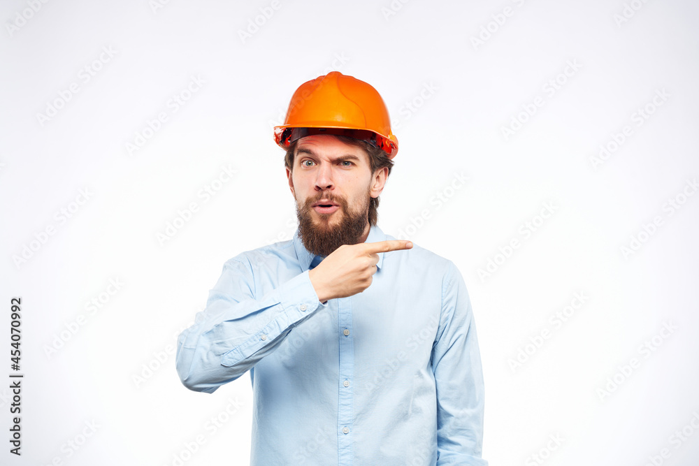 man in orange paint shirt construction work studio man in orange paint shirt construction work studio