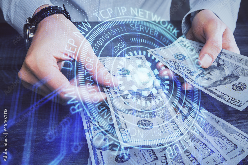 Double exposure of technology drawing hologram and us dollars bills and man hands. Data concept Double exposure of technology drawing hologram and us dollars bills and man hands. Data concept