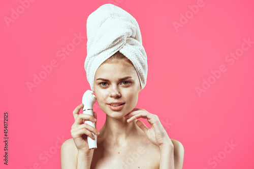woman with towel on head naked shoulders massage medicine cosmetics