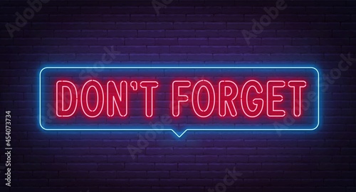Don t Forget neon sign on brick wall background.