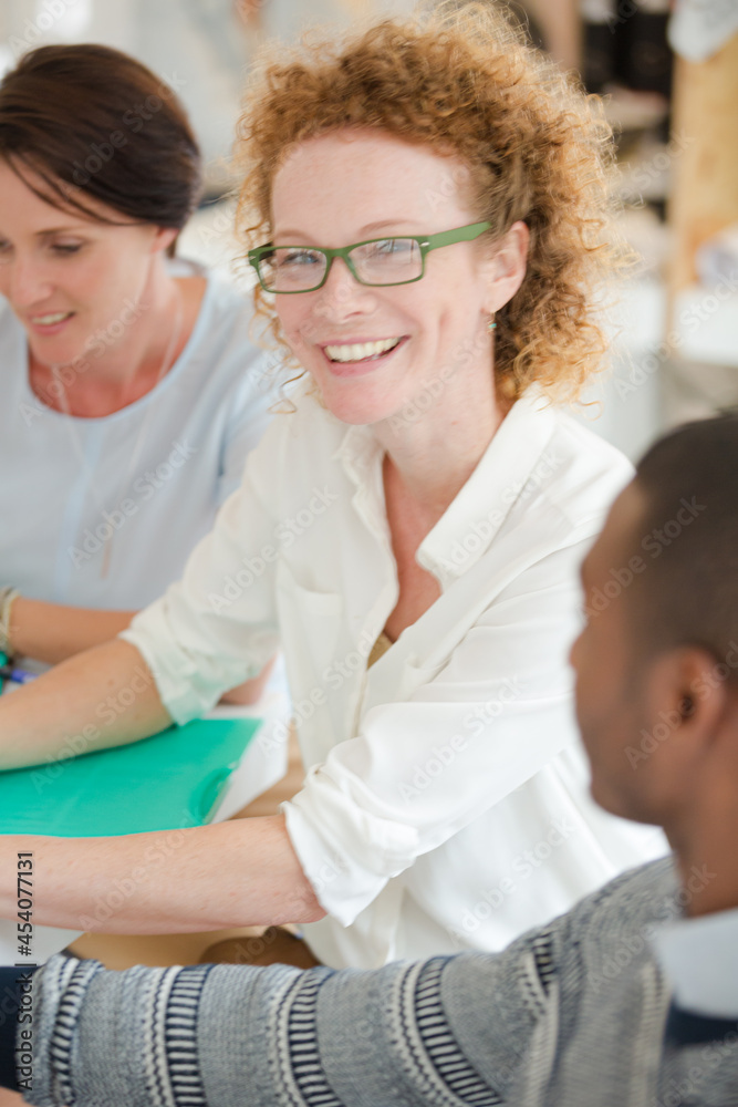 Fototapeta premium Office workers talking at desk