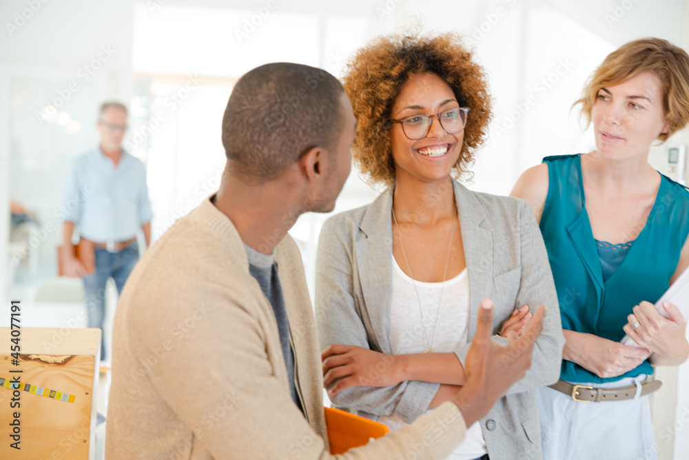 Fototapeta premium Portrait of talking and smiling office workers