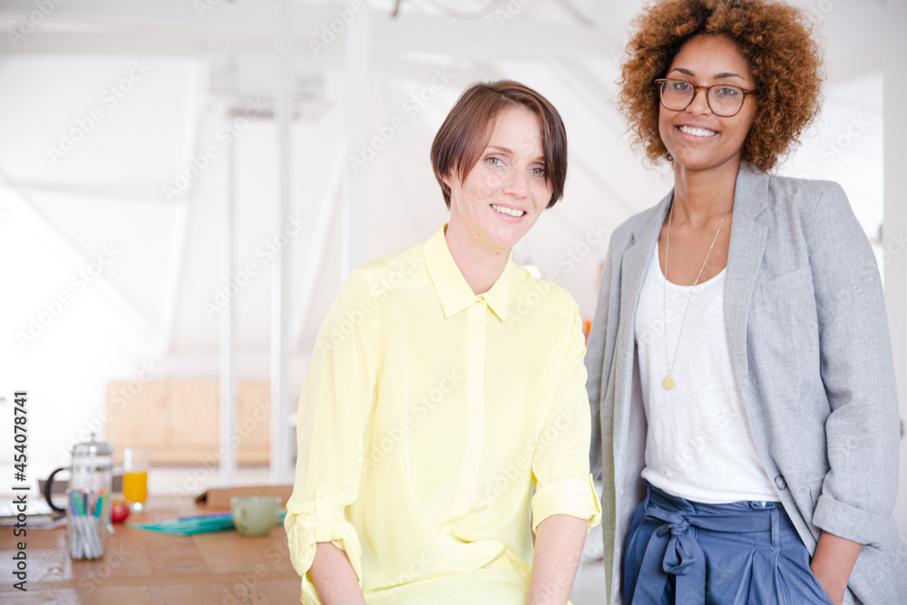 Portrait of two smiling office workers Portrait of two smiling office workers