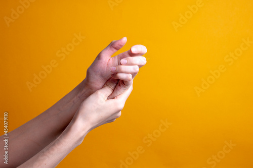 woman holds her hand - pain concept
