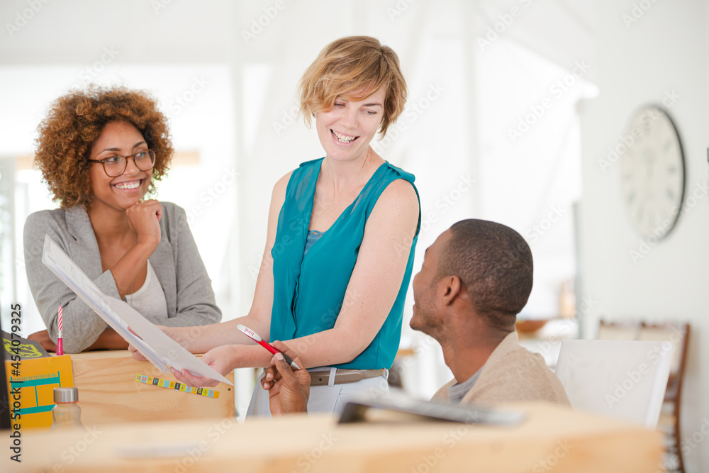 Fototapeta premium Office workers talking at desk
