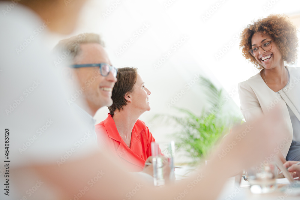 Office workers talking at desk Office workers talking at desk