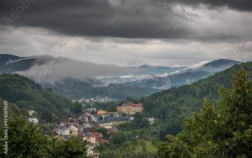 rain and heavy black clouds over a small town in the valley / Štramberk, Czech Republic