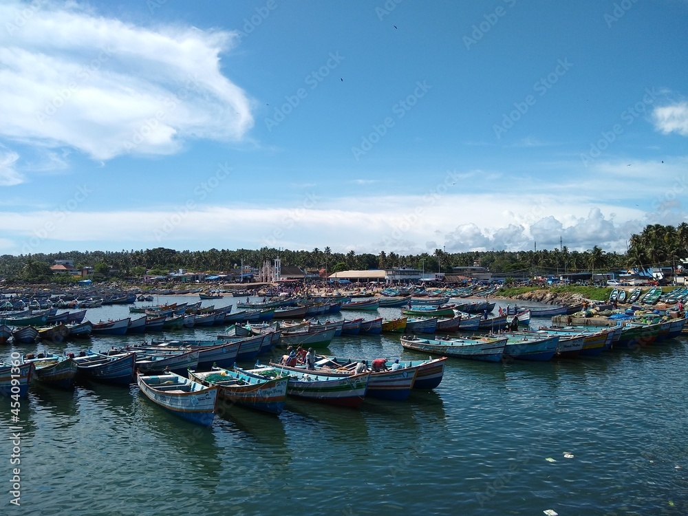 fishing boats in vizhinjam Harbor, Thiruvananthapuram Kerala, blue sky background, seascape view