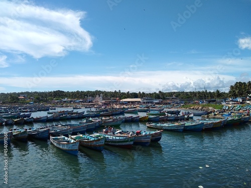 fishing boats in vizhinjam Harbor  Thiruvananthapuram Kerala  blue sky background  seascape view