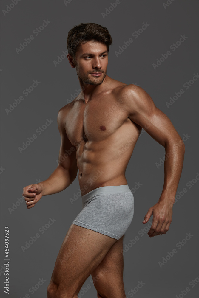 Fototapeta premium Young european man with naked sportive torso