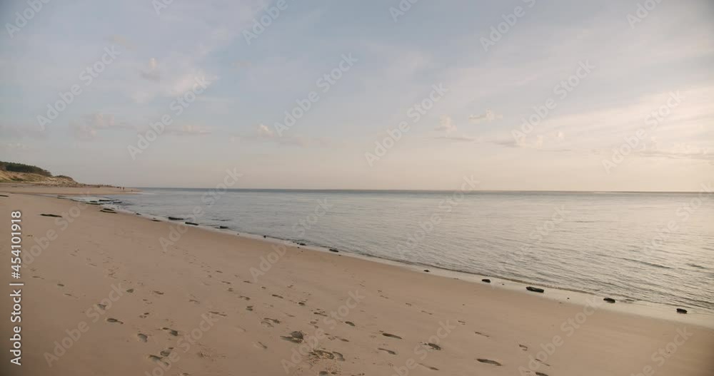 Panorama of Empty Beach With Calm Ocean At Sunrise. - wide shot Panorama of Empty Beach With Calm Ocean At Sunrise. - wide shot