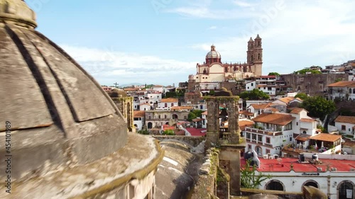 Taxco is a town in the state of Guerrero, famed for Spanish colonial architecture. Plaza Borda, the main square, is home to the landmark 18th-century Santa Prisca church, churrigueresque style. photo