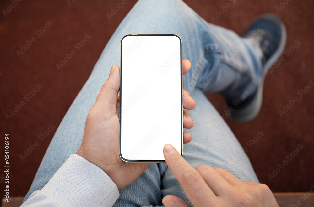 male hands holding phone with isolated screen background of jeans male hands holding phone with isolated screen background of jeans