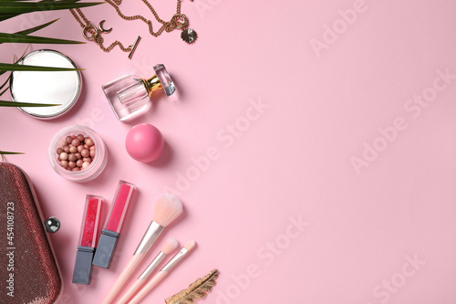 Fototapeta Naklejka Na Ścianę i Meble -  Flat lay composition with makeup products on pink background, space for text
