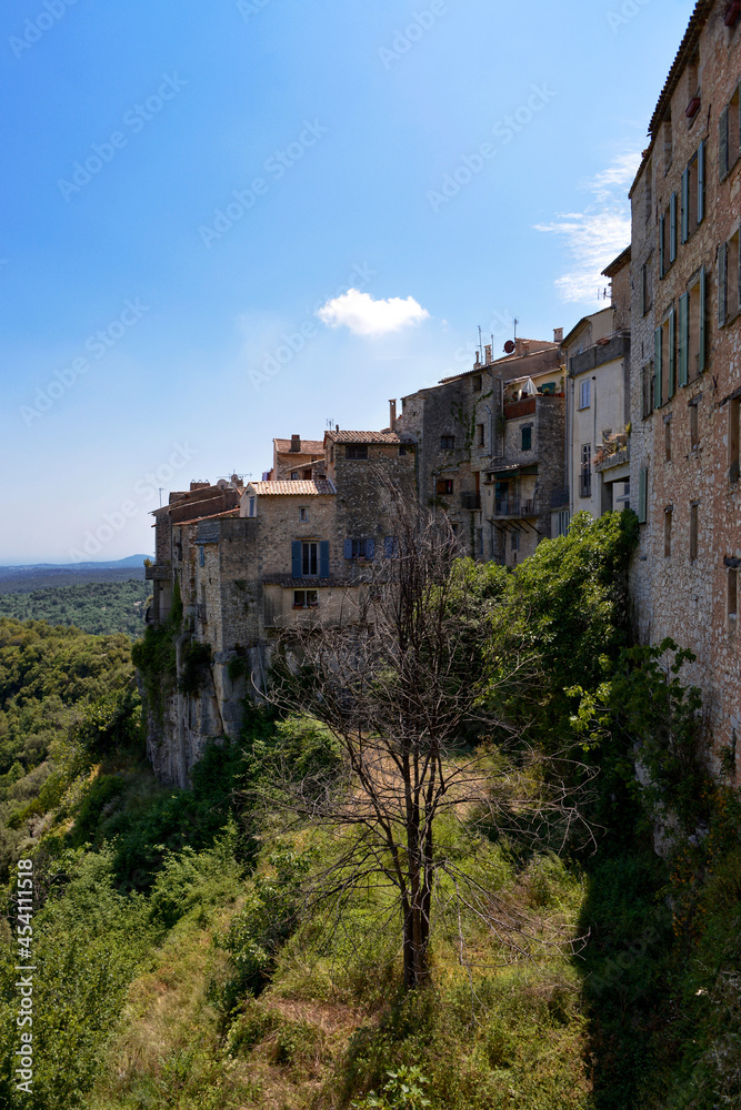 View of the exterior of the village with its high facades at Tourrettes-sur-Loup, a commune in the Alpes-Maritimes department in southeastern France