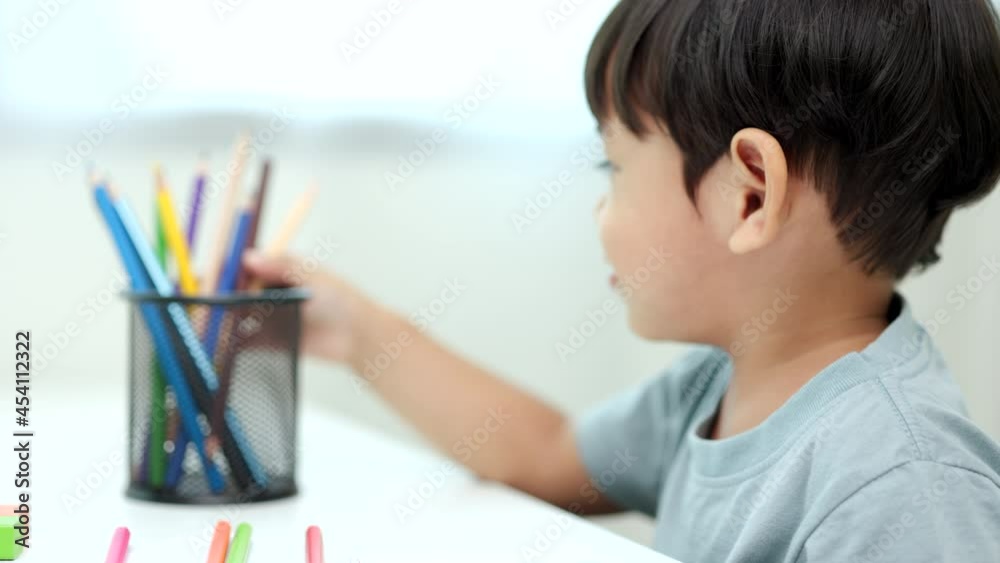 Asian little boy education from home. Developing children's learning before entering kindergarten Practice the skills of playing with wooden toys and drawing and painting.
Asian little boy education from home. Developing children's learning before entering kindergarten Practice the skills of playing with wooden toys and drawing and painting.