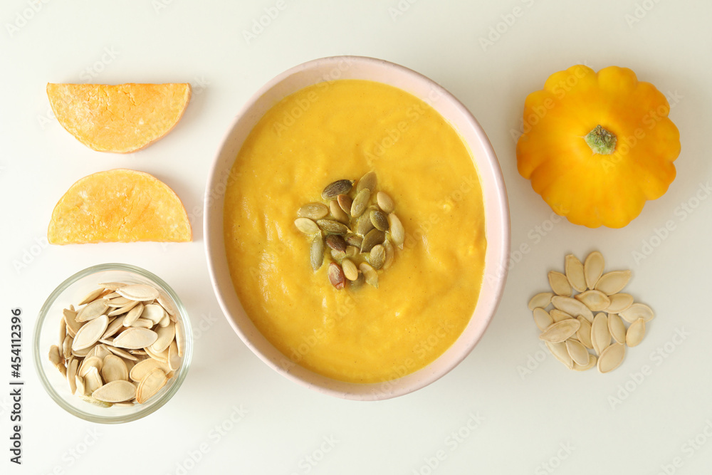 Flat lay with pumpkin soup ingredients on white background Flat lay with pumpkin soup ingredients on white background