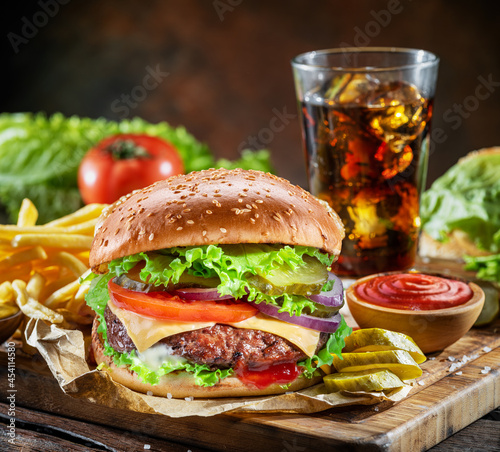 Delicious hamburger with cola and potato fries. Fast food concept. File contains clipping path.