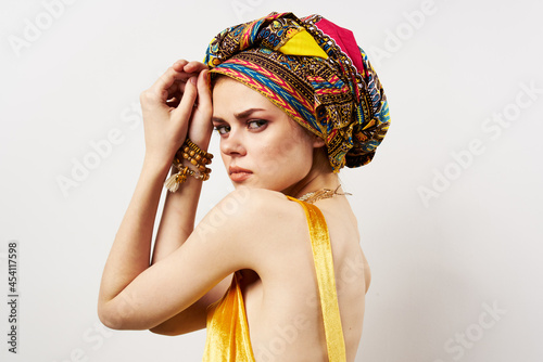 cheerful pretty woman multicolored turban african style close-up © SHOTPRIME STUDIO