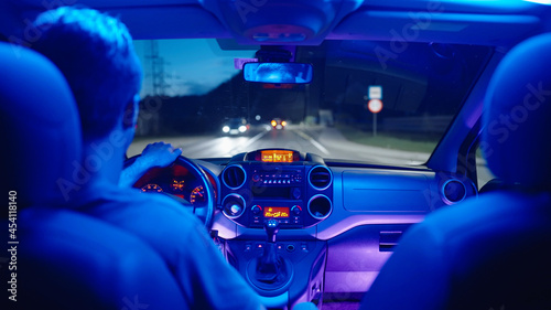 Driving car with retro neon lights inside