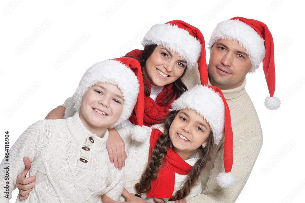 Close up portrait of family with kids in santa hats Close up portrait of family with kids in santa hats