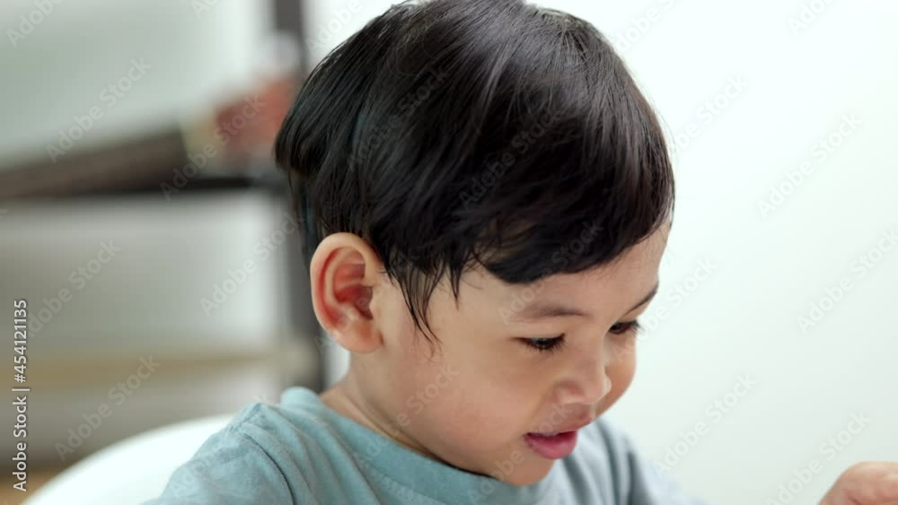 Asian little boy education from home. Developing children's learning before entering kindergarten Practice the skills of playing with wooden toys and drawing and painting.
Asian little boy education from home. Developing children's learning before entering kindergarten Practice the skills of playing with wooden toys and drawing and painting.