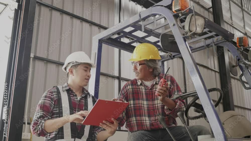 custom made wallpaper toronto digitalFactory engineer and staff checking goods on shelves in warehouse. Worker or staff consult on transportation management. Cooperation working in warehouse. Business owner talking to team. Blue collar