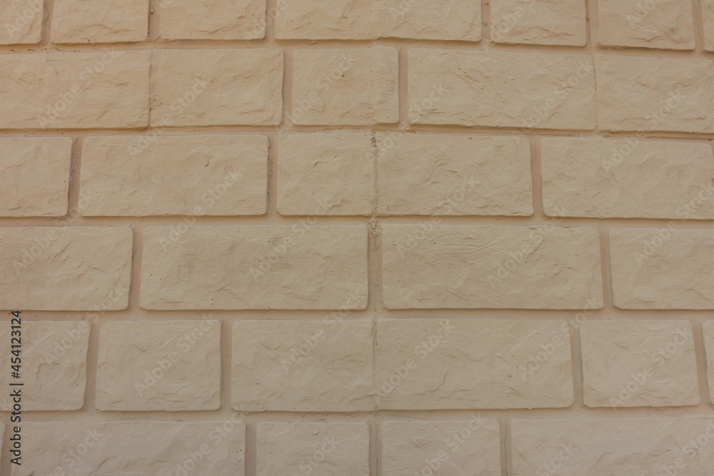 Surface of pale yellow brick veneer wall Surface of pale yellow brick veneer wall